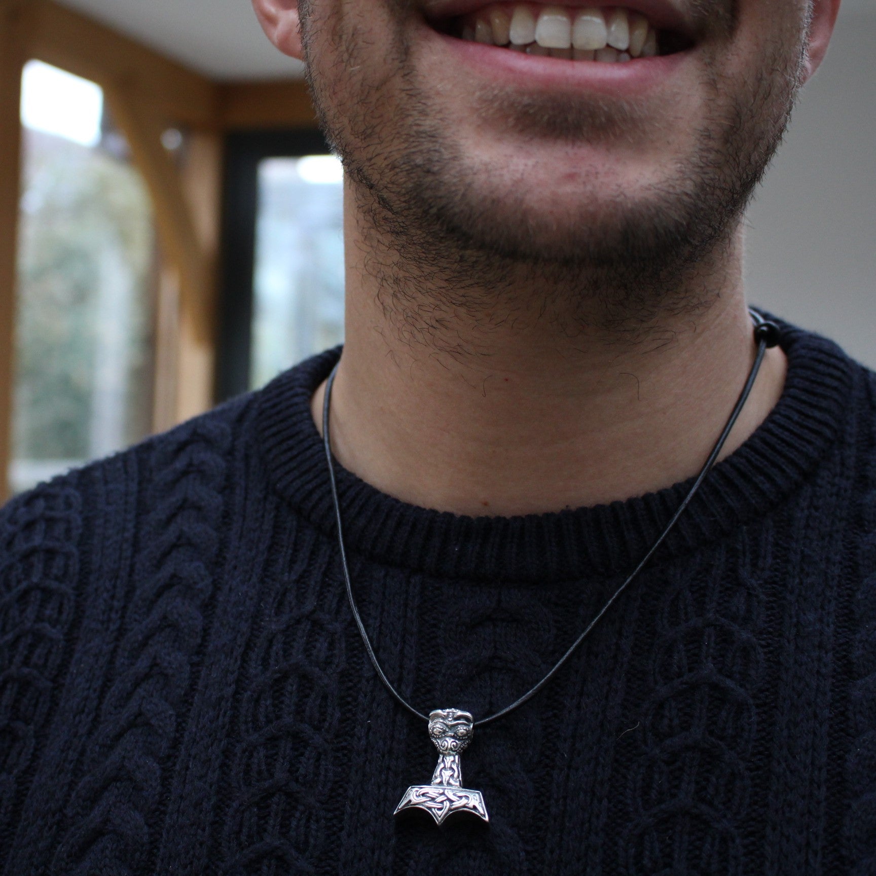 hrathnir_  Hræsvelgr Holding Mjolnir Necklace